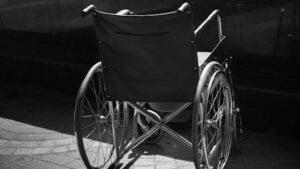Black and white image of an empty wheelchair