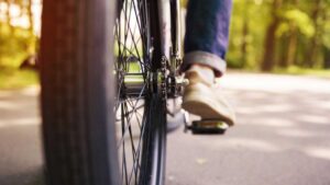 A neat shot of the back of a bicycle driving down the road