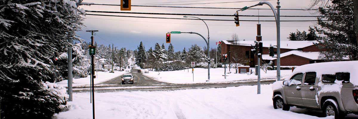 Vehicle approaching a snowy intersection