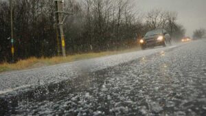 Car driving in a hail storm.