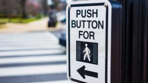 Push the crosswalk button to cross road crosswalk sign in the Maritimes