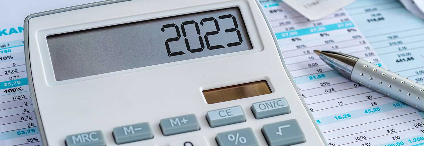 Photo of a calculator on top of an income budget