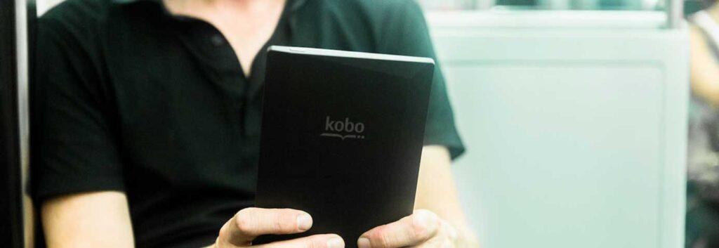Man read a kobo on a bus