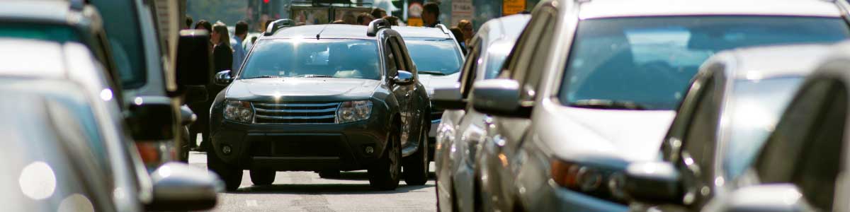 A car changing a lane on a busy city street