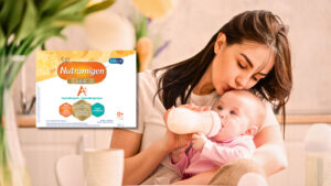 Mother feeding her baby Enfamil Nutramigen A+ L-G-G Hypoallergenic formula which has been recalled