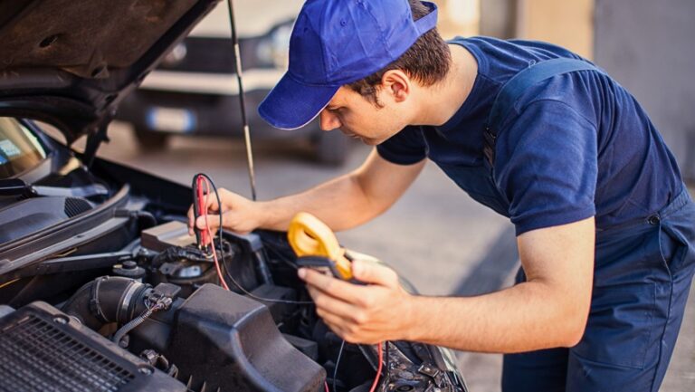 Mechanic doing spring maintenance on a car.