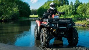 An ATV driving in the woods of Atlantic Canada
