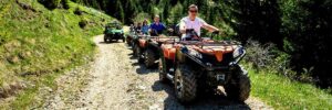 A group of atv'ers in a line on an atv trail