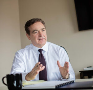 Joseph Cantini talking to a client about a personal injury case.